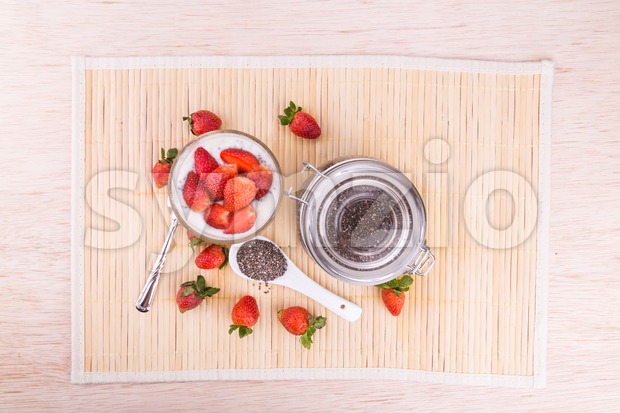 Chia seeds pudding with strawberry fruits, healthy nutritious anti-oxidant superfood. Stock Photo