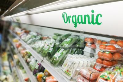 Organic food signage on modern supermarket fresh produce vegetable aisle Stock Photo