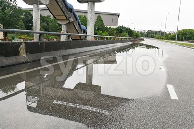 Waterlogged on road due to clogged drainage system Stock Photo