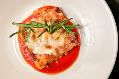 Overhead view of closeup of fine dining italian lasagna Stock Photo
