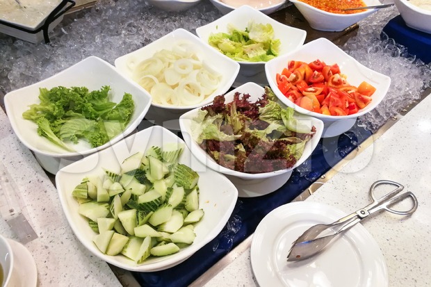 Healthy appetizing vegetable breakfast organic salad, tomato, onion, cucumber, dressing Stock Photo