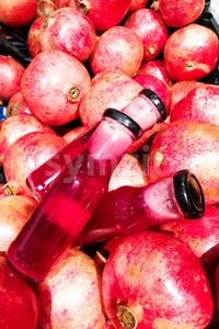 Fresh cold pressed organic pomegranate juice against pomegramate fruits Stock Photo