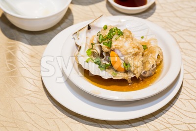 Steamed fresh scallop with clamp shell in Chinese meal Stock Photo
