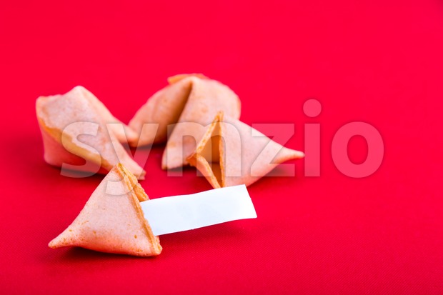 Fortune cookies with blank predictive label on red background Stock Photo