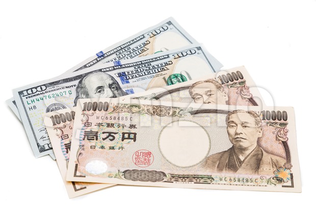 Close up of Japanese Yen currency note against US Dollar. Stock Photo