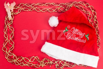 Beautiful ornaments framed Christmas decoration in red background. Stock Photo