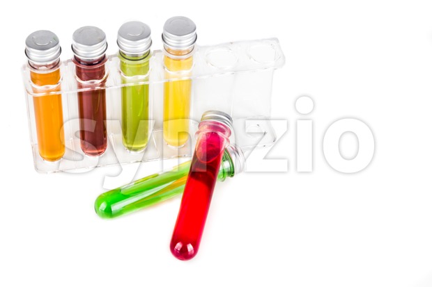 Test tubes with multi color chemicals isolated in white Stock Photo
