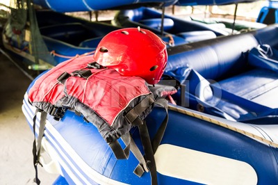 Safety helmet and life jacket, essential safety kit for canoeing and kayaking activities Stock Photo
