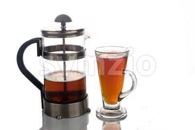 Freshly brewed hot tea in transparent glass with portafilter Stock Photo