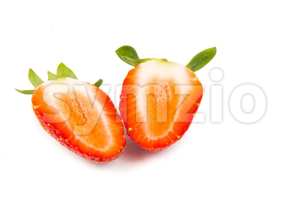 Closeup of sliced fresh juicy organic strawberries with white background Stock Photo
