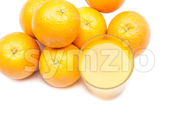 Fizzy orange juice from effervescent tablet with oranges at backdrop Stock Photo